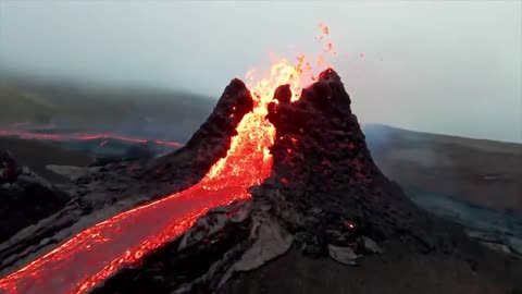 Drone captures incredible footage of man running towards erupting volcano Really