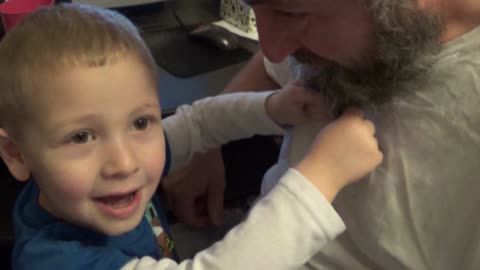 Little Boy Pretends To Milk His Dad's Beard