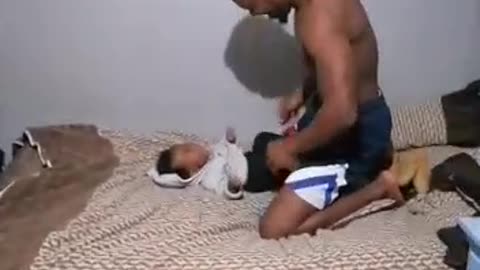 Father Wrestles With His Toddler