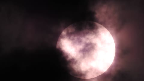 sun close up through clouds