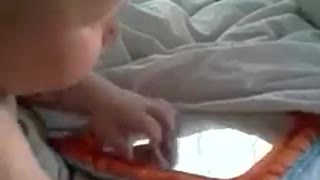 Baby discovers self in the mirror