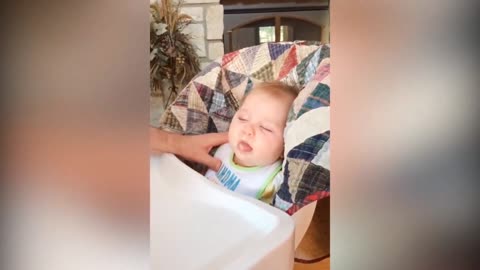 Sleepy baby hits head on table after eating 😂
