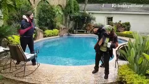 Boy falls into pool during snowball fight