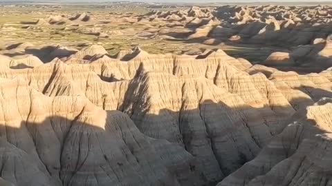 The dramatic landscapes of Badlands National Park span layered rock formations