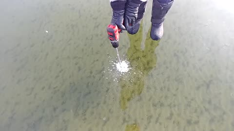 checking ice thickness on lake Wabamun