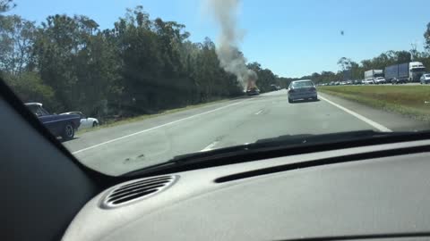 Classic 1955 Chevrolet catches fire on side the highway
