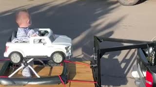 Tiny Car Towing Brother on Custom Trailer