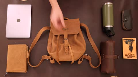 The 12" Tumbled Leather Drawstring Backpack - What It Fits