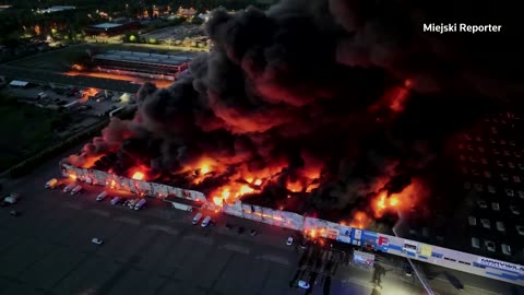 Flames engulf a Polish shopping center