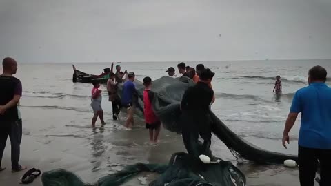 Indonesian fishermen fishing on the beach