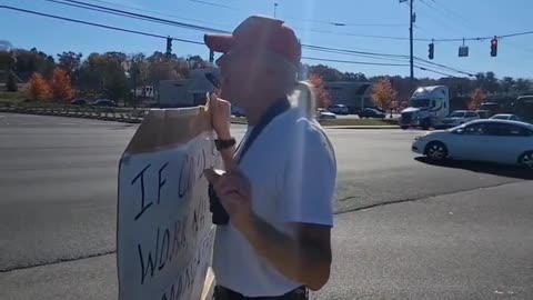 THIS MAN THAT WAS PEACEFULLY PROTESTING IN FRONT OF WALMART & SOME PEOPLE DRIVING BY WERE HATIN