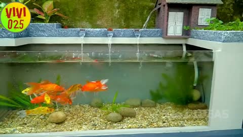 My father creates an incredible waterfall aquarium for our barren garden.