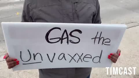 Liberal Covid Cultists in TX Holds Sign saying "Gas ALL UnVaxxed" wants us dead