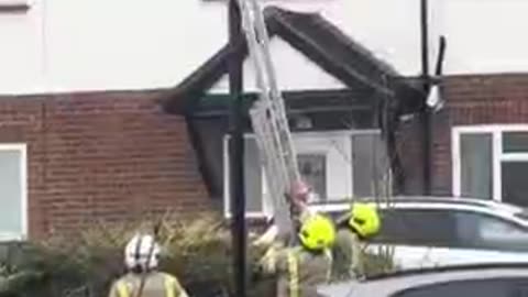 Firefighters remove bin covering ULEZ enforcement camera in London UK
