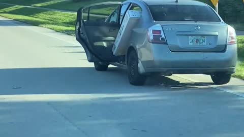 Car Transporting Large TV Has to Keep Door Open