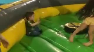 Kiddo Gets Continuously Knocked Down by Spinning Obstacle Arm