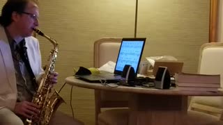 My husband playing saxophone