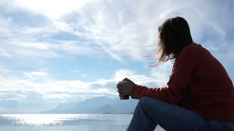 Drinking coffee on the beach