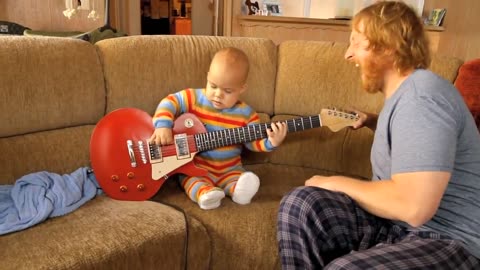 Guitar baby video viral Rocksmith baby paying in the room