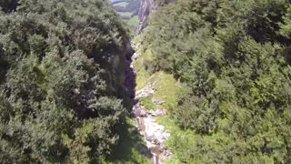 Wingsuit basejump from top of mountain to beach