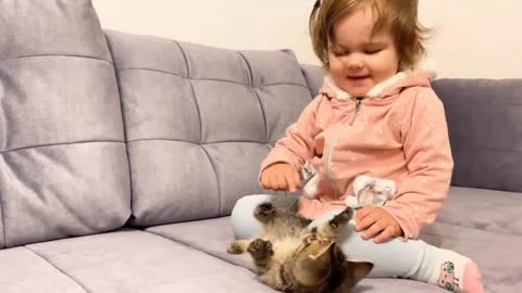 Cute baby meets new baby kitten for the first time !!!!