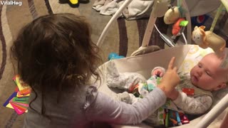 Big Sister Teaches Baby Brother How to Sign