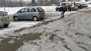 Guy black sweater jacket skateboard ice parking lot