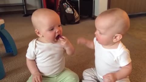 Two adorable babies fighting