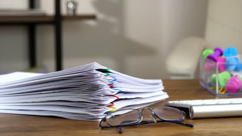 Nice Stop Motion Video of a Stack of Paperwork on the Desk.
