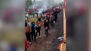 Tens of thousands of illegals attempt to catch a train in Mexico bound for the U.S. border