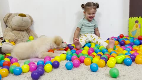 Baby_and_Dod_Funny_Playing_with_Сolorful_Balls