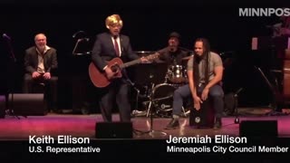 Keith Ellison sports a blonde wig, singing a song about Trump