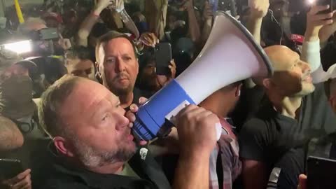 Alex Jones with protesters