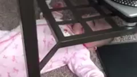 Baby stuck under table, so cute