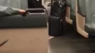 Woman uses green hand weight on the subway