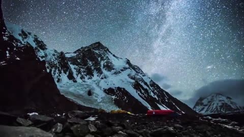 Time lapse video of night sky with fog and snow.