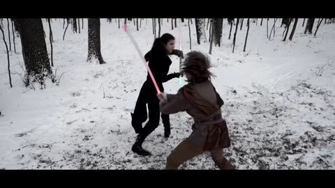 Lightsaber duel in winter forest
