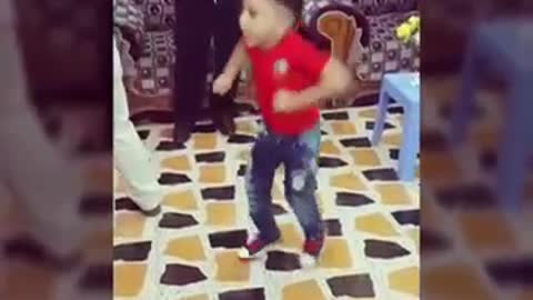 A very kid doing amazing dancing step in marriage ceremony in arab