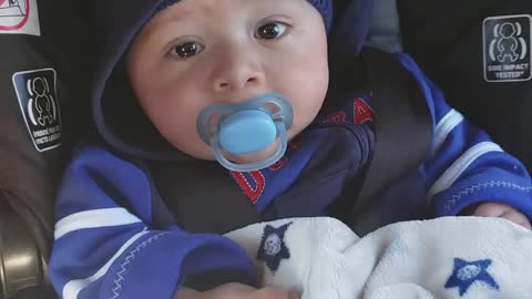 Cute baby in car seat