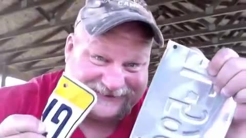 Redneck Ripping License Plate In Teeth