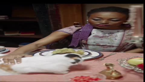 Woman Petting Her Cat On The Dining Table..Cat Licking The Crystal Glass On Top Of The Table