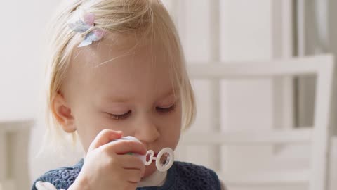 A Child Blowing Bubbles