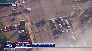 A group of pro-Palestine protesters are blocking traffic outside LAX