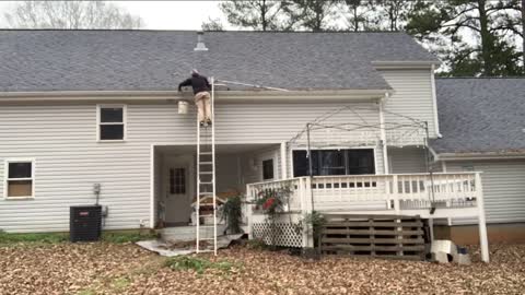 GUTTER CLEANING: Working from the ladder