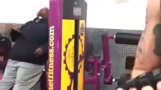 Guy Eats Pizza While Working Out At A Fitness Club