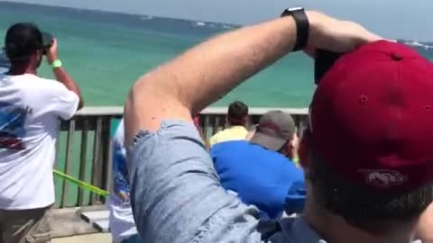 U.S. Navy Blue Angels perform stunt over Pensacola Pier in Florida