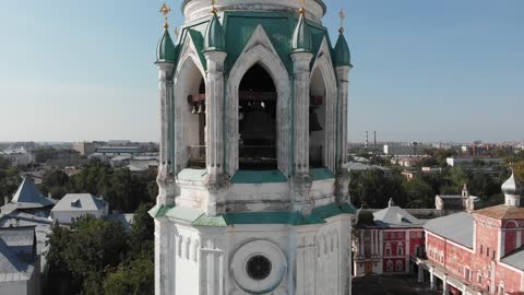 The drone rises and removes the dome of the church.