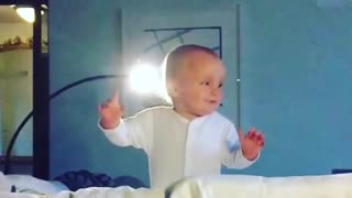 Cute little boy learning to stand up - falls repeatedly