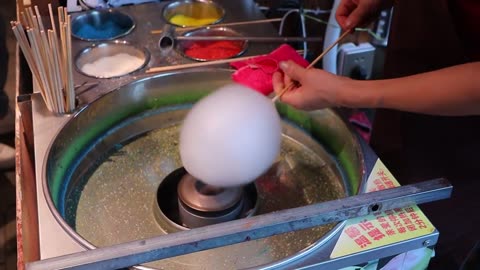 Cotton candy made of colorful pieces / cotton candy art - chinese street food