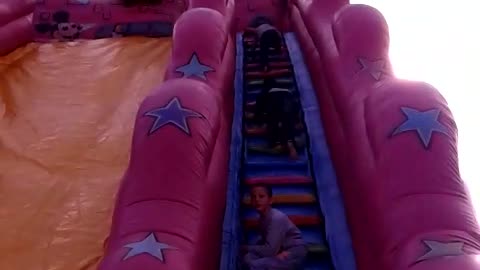 Get on the inflatable slide